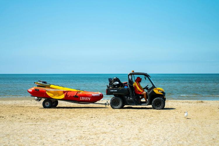 Lifesaving Victoria lifeguards in buggy on sand at Werribee South Beach